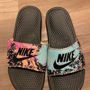 Nike Black Slides with Vibrant Splatter Design